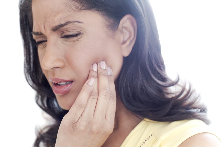 Woman feels TMJ in her jaw