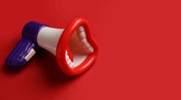 Megaphone with teeth to represent dental advertising