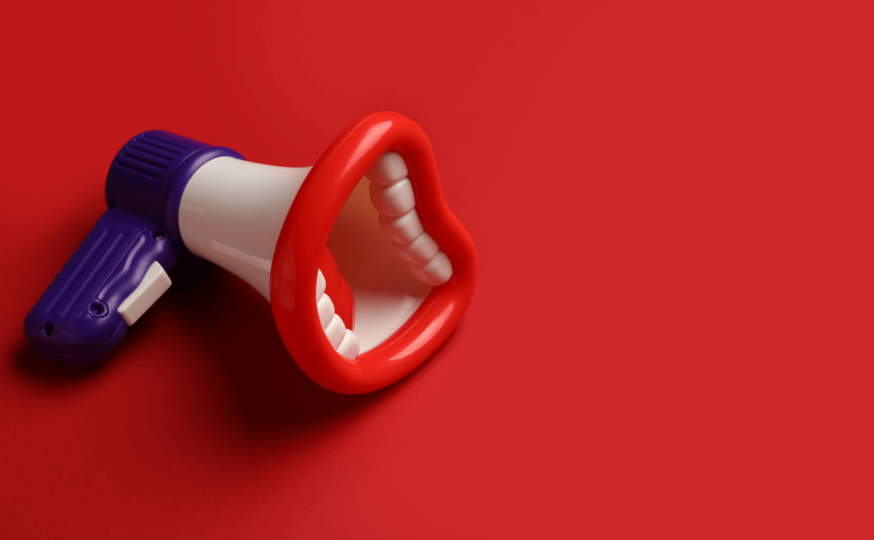 Megaphone with teeth to represent dental advertising